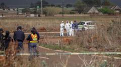 Two charged with woman's murder as South Africa police investigate eight other body finds