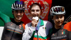 Cyclist who dressed as man to avoid Taliban wins silver medal